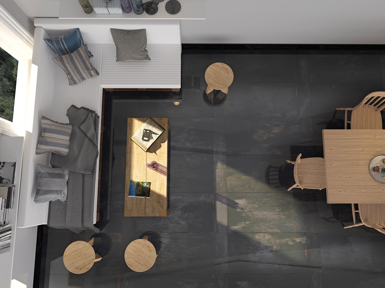 Neste espaço amplo, um porcelanato mais escuro, da linha Oxide, contrasta com paredes brancas e móveis claros, garantindo a boa iluminação do ambiente sem abrir mão do charme.