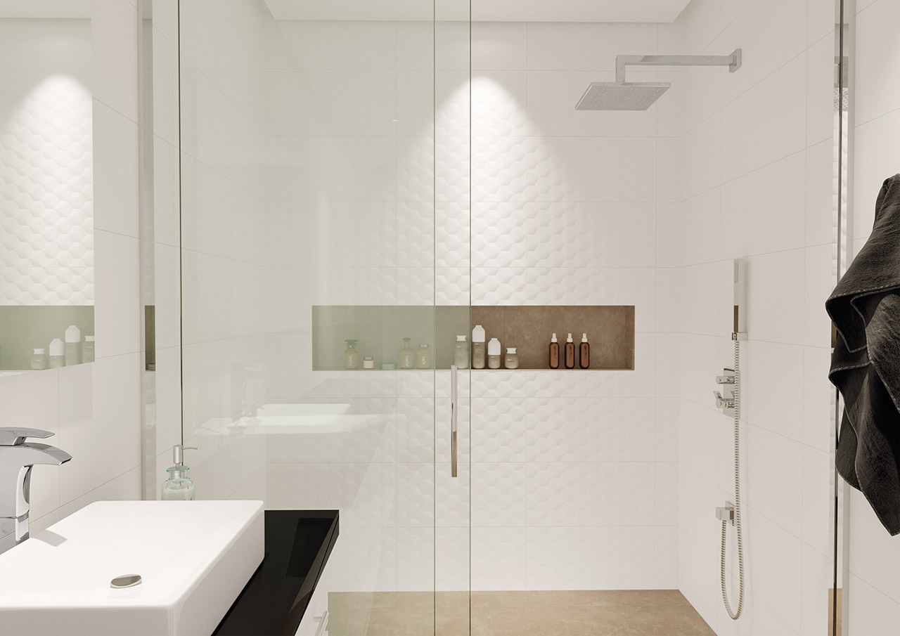 Neste banheiro, a linha Charm foi o revestimento escolhido para proporcionar mais elegância e amplitude à parede. As poucas cores contrastantes ganham destaque diante da predominância do branco.